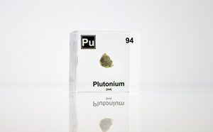 Plutonium element cube close-up showing metallic surface detail, collector gift for science fans