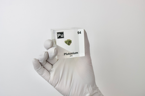 Plutonium element cube held in hand showing scale, rare atomic science collector gift