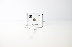Plutonium element cube facing left with trinitite sample, nuclear history collector gift