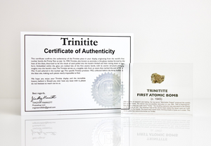 Trinitite specimen with certificate of authenticity on white background, collector gift