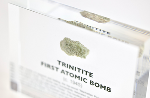 Trinitite atomic glass close-up showing vitrified sand texture, nuclear history collector gift