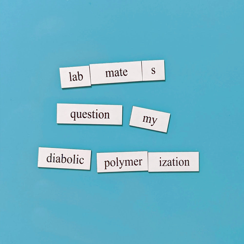 white chemistry word magnet tiles on a light blue background