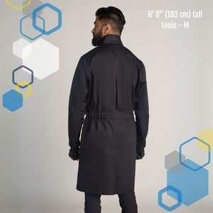mens long knee length medium size black cotton lab coat on a male microbiologist with tailored fit and adjustable belt and high collar, looking like a mad scientist halloween costume