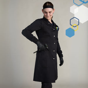 female engineer wearing a small black 100 percent cotton scientist lab coat wearing black gloves using pockets and loops for utensils