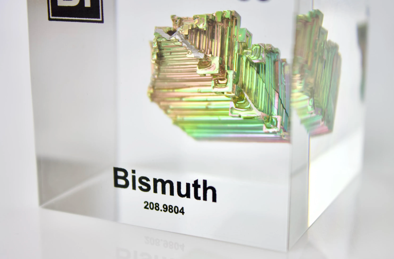 Bismuth element cube close-up showing metallic surface texture, collector gift for science fans
