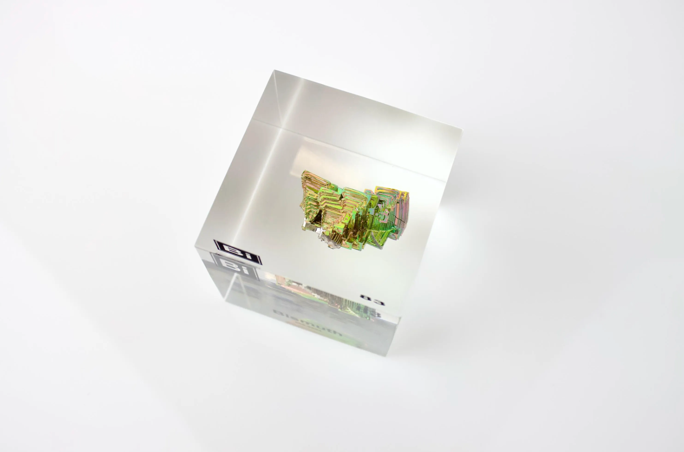 Bismuth element cube top view showing iridescent rainbow surface, collector gift for science fans