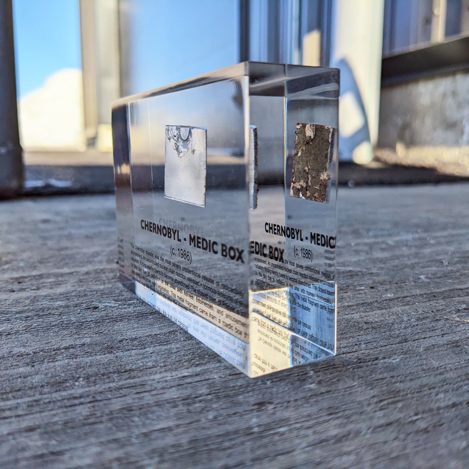 Chernobyl Medic Box acrylic display against window background, nuclear history collectible, collector gift