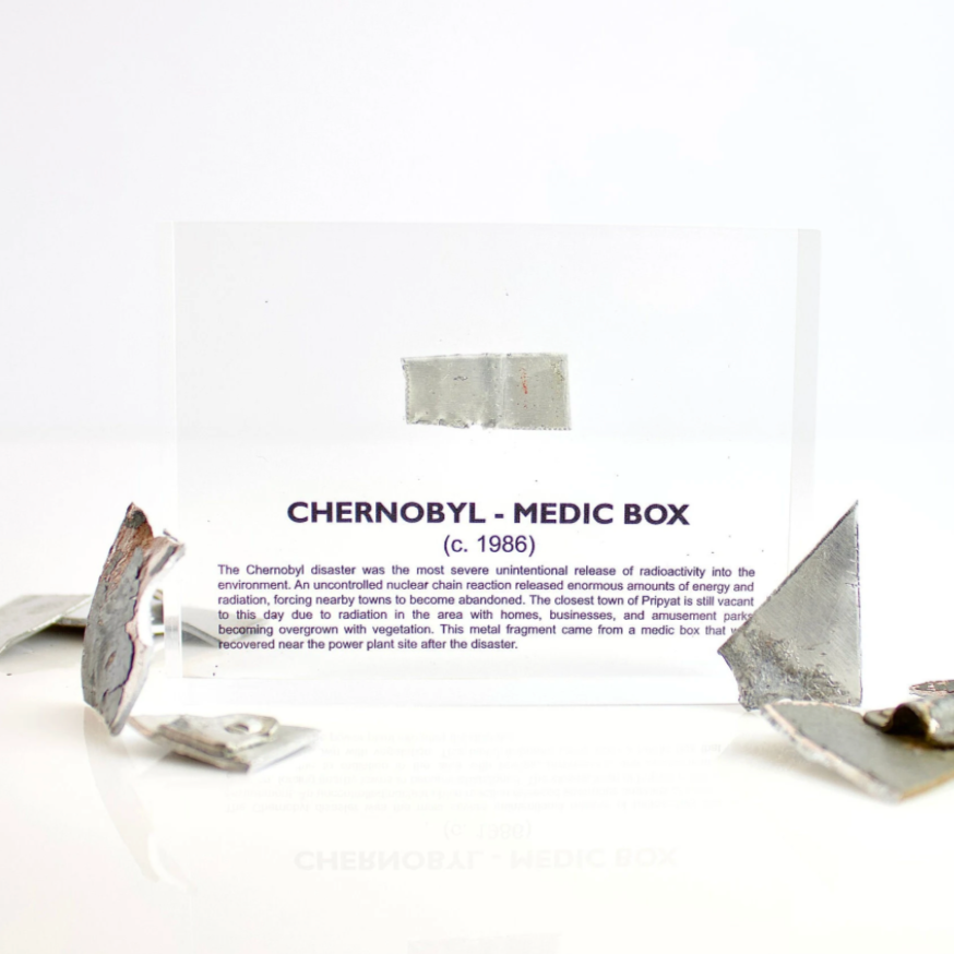 Fragment of a Chernobyl nuclear plant medic box encased in acrylic as a desk display, collector gift