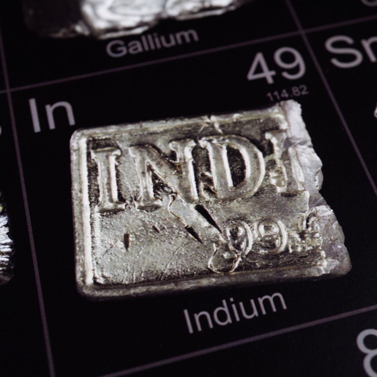 science classroom hanging poster periodic table in photos of each element showing potassium, calcium metal, cesium, and lanthanides series. Photos by Theodore Gray