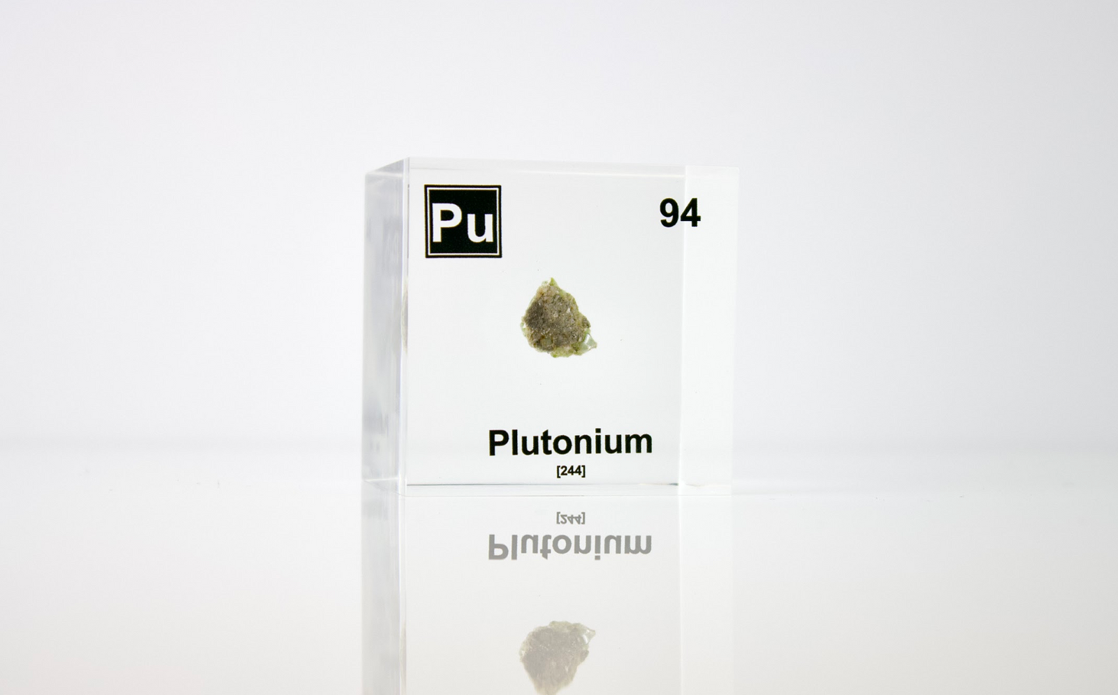 Plutonium element cube close-up showing metallic surface detail, collector gift for science fans