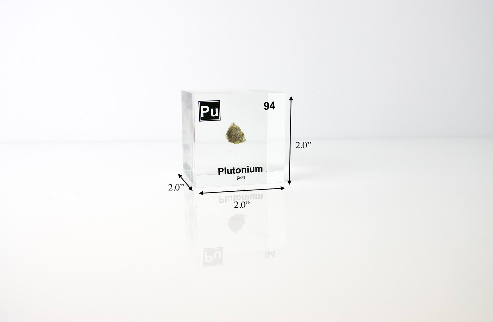 Plutonium element cube facing left with trinitite sample, nuclear history collector gift