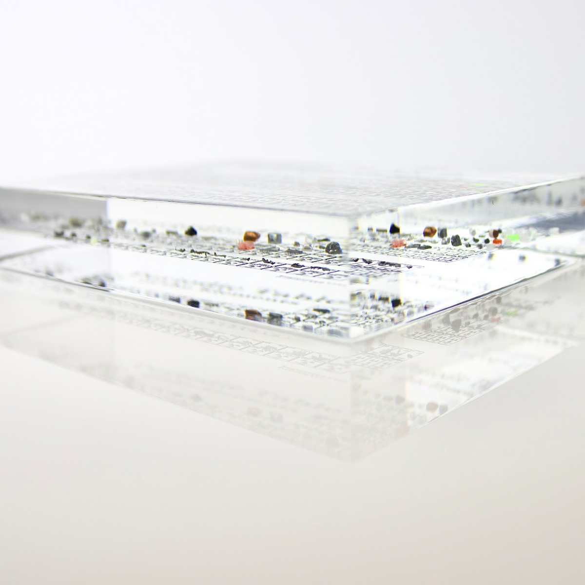 Heritage periodic table desk display showing real element samples in acrylic case, collector gift