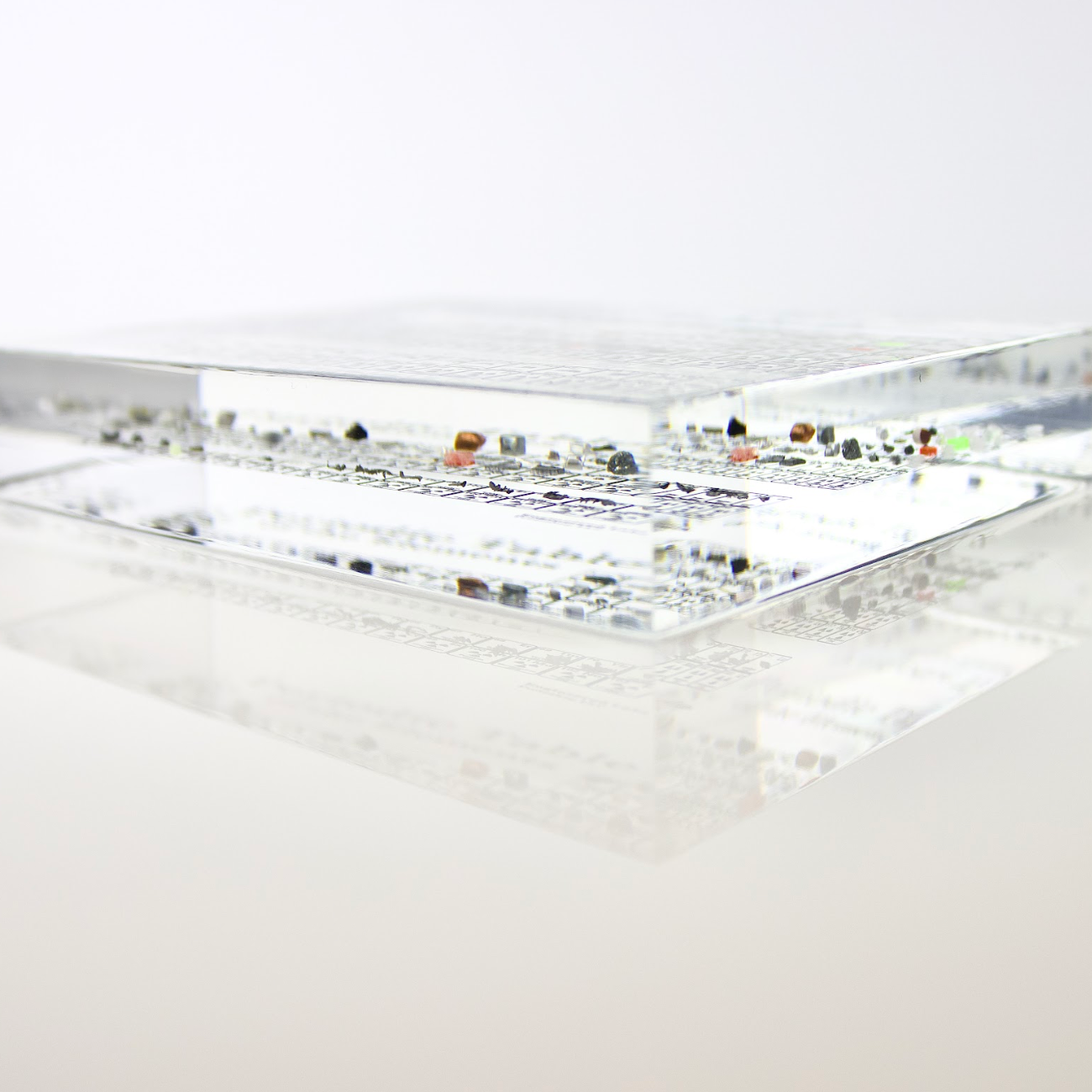 Heritage periodic table desk display showing real element samples in acrylic case, collector gift