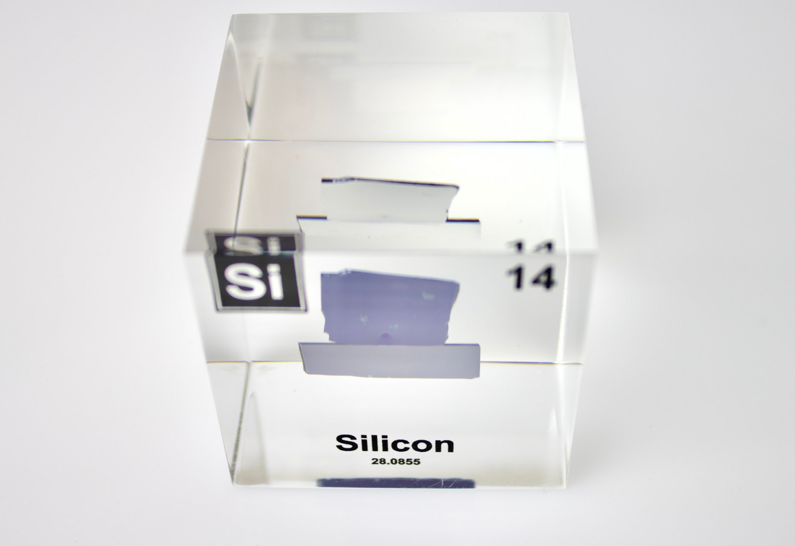 Silicon element cube close-up view on white background, science gift for periodic table fans