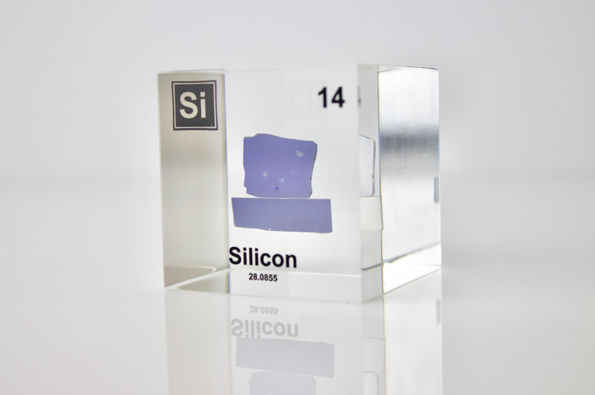 Silicon element cube in acrylic display on white background, collector gift for science enthusiasts