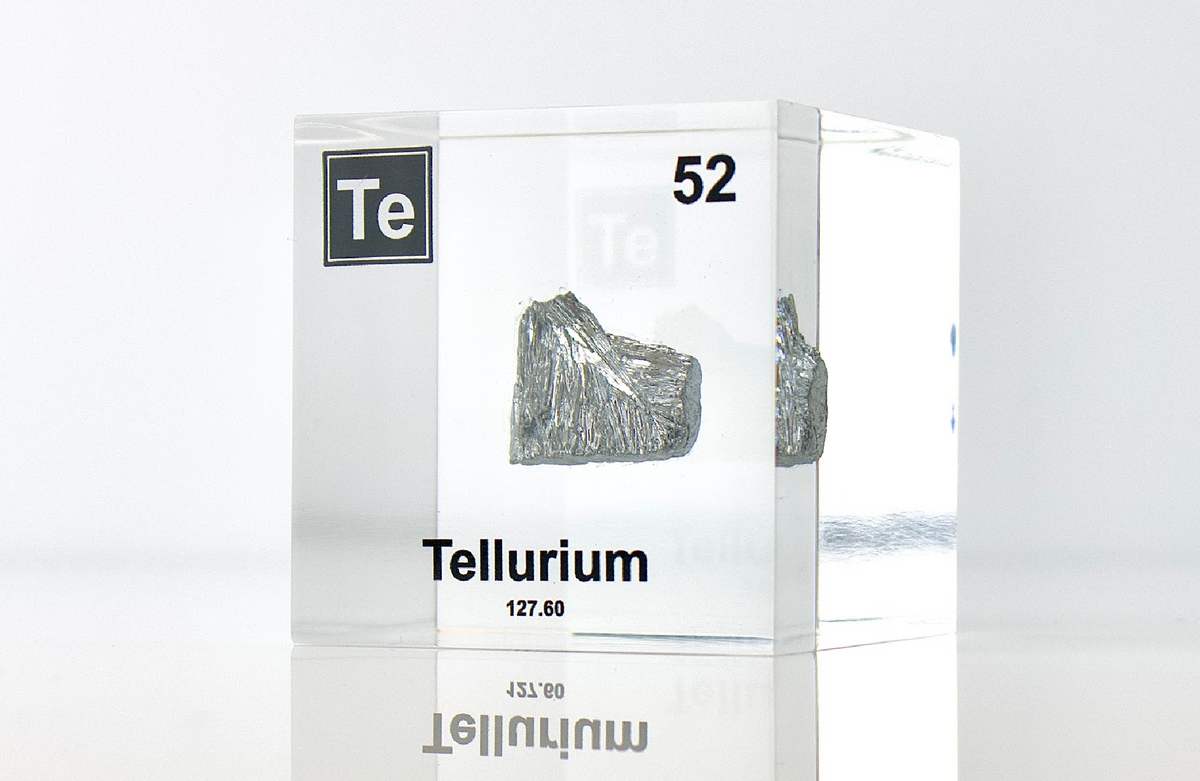 Tellurium element cube front view on white background, collector gift for periodic table fans