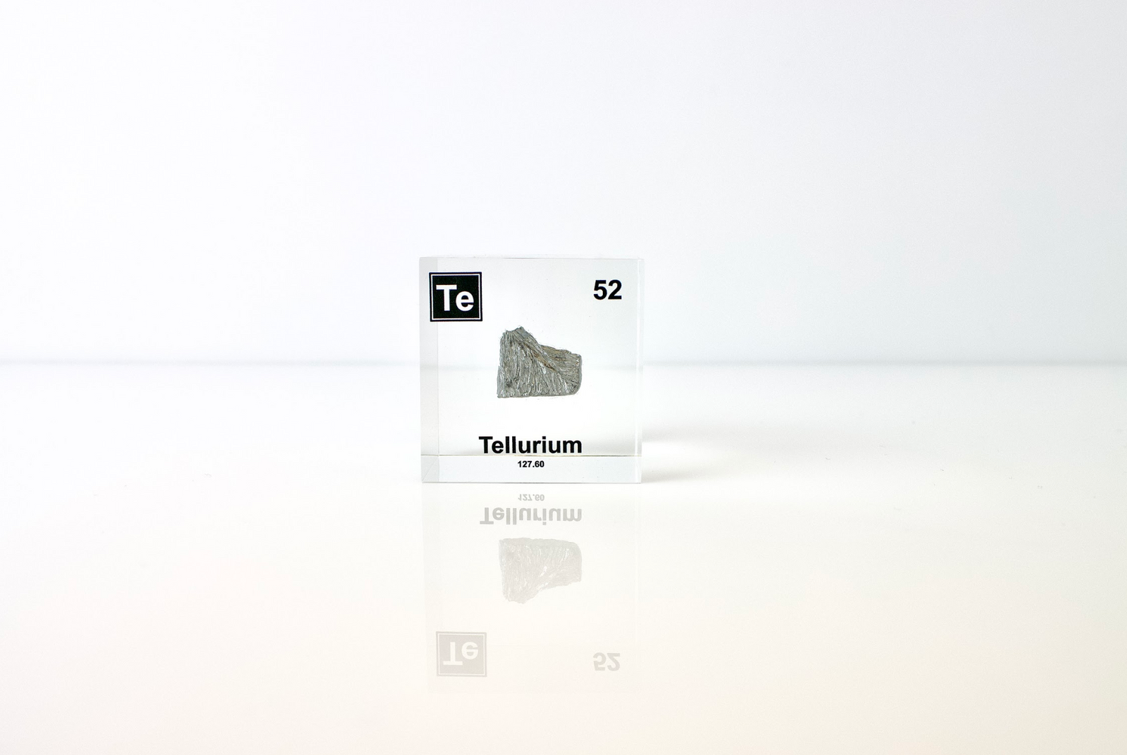 Tellurium element cube angled view showing silvery metallic surface texture, collector gift