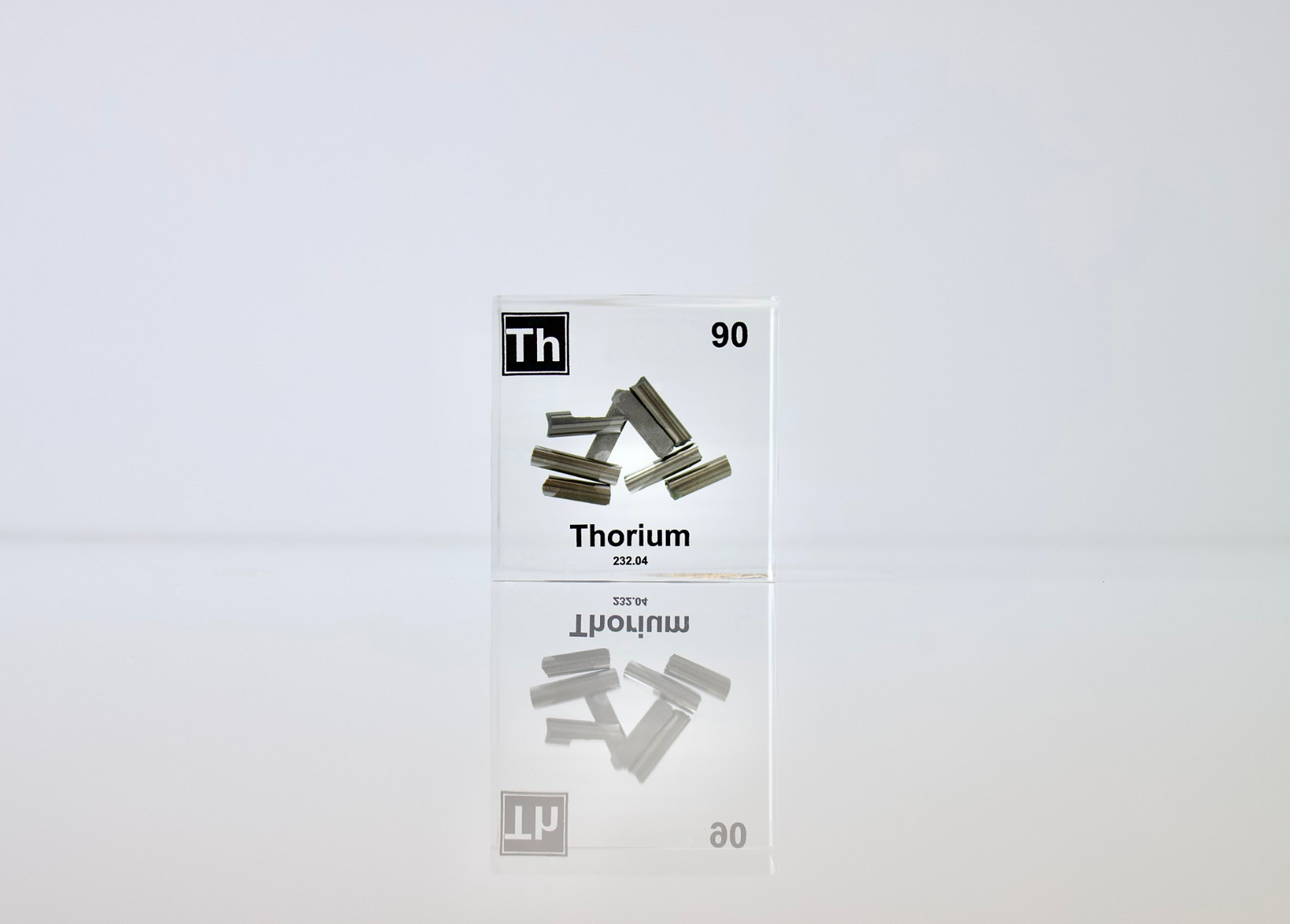 Thorium element cube angled view showing metallic silver surface, collector gift