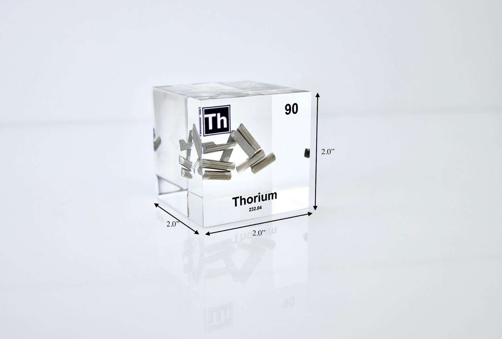 Thorium element cube with dimension measurements on white background, collector gift