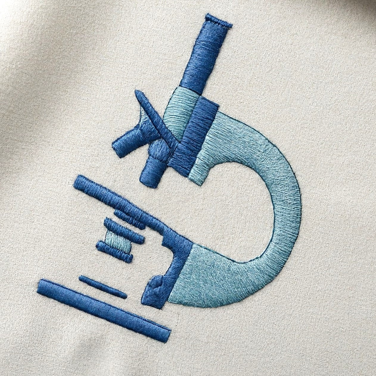 GLG - embroidered logo on lab coat