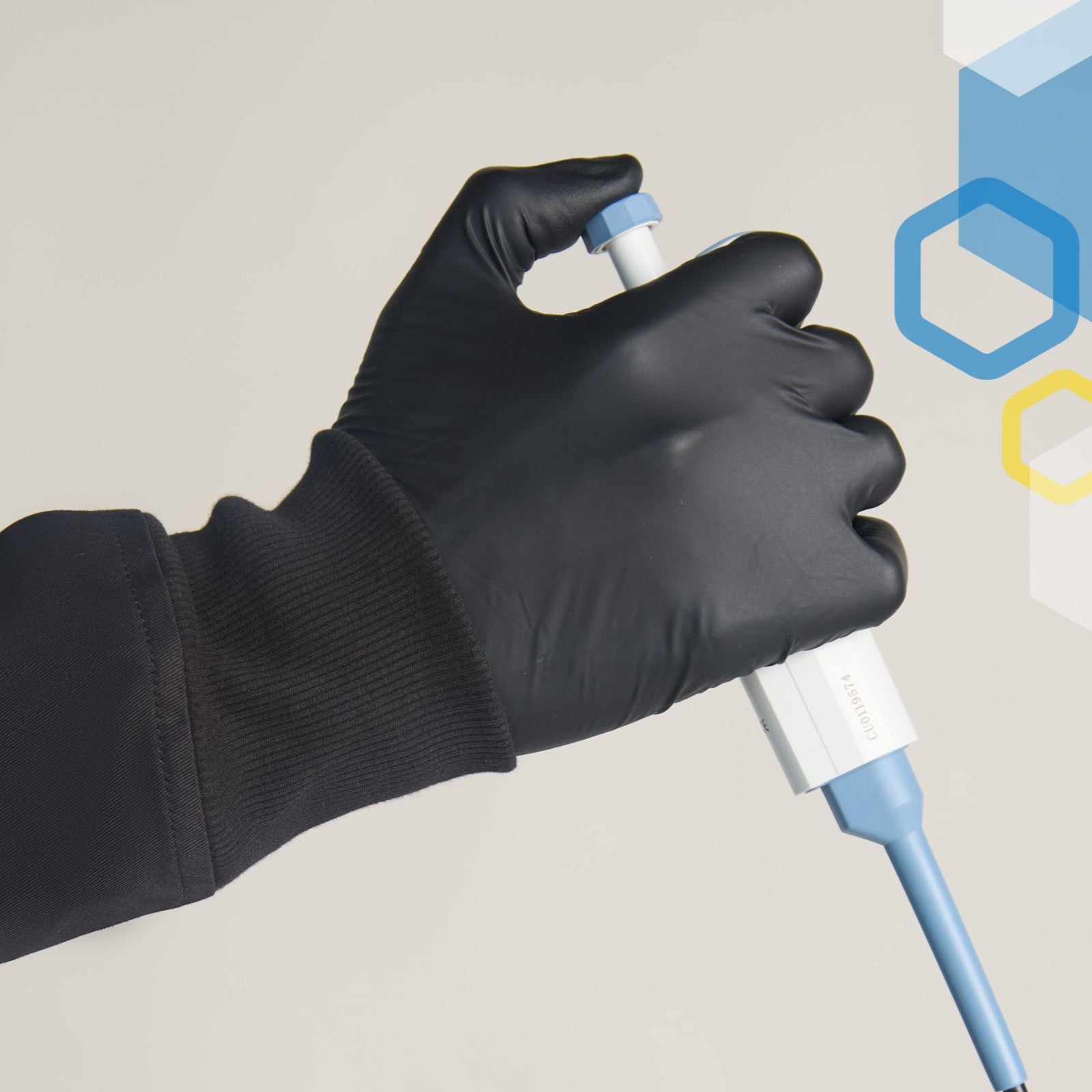 soft stretchy long knit cuffs on a black cotton lab coat wearing a black glove holding a scientist micropipette