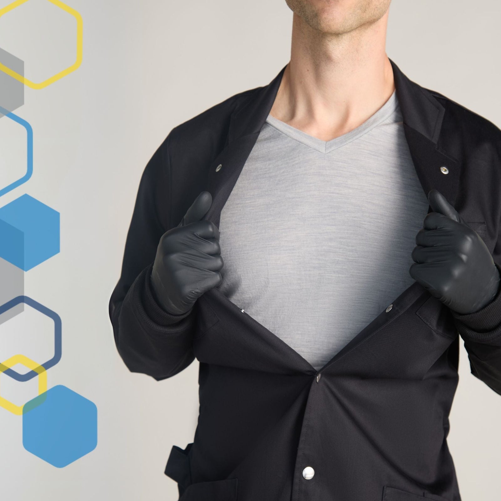 man wearing black microbiology lab coat looks like a mad scientist costume with metal snaps in the front closure