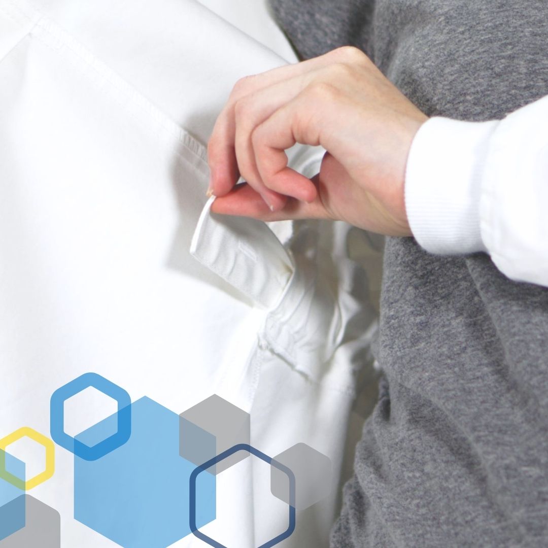 scientist woman wearing maternity lab coat with adjustable waistband to expand for 2nd and 3rd trimester of pregnancy, in white cotton, from genius lab gear