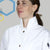 pregnant female wearing a white cotton lab coat with a high collar that protects her chest during laboratory research like chemistry, with metal snaps