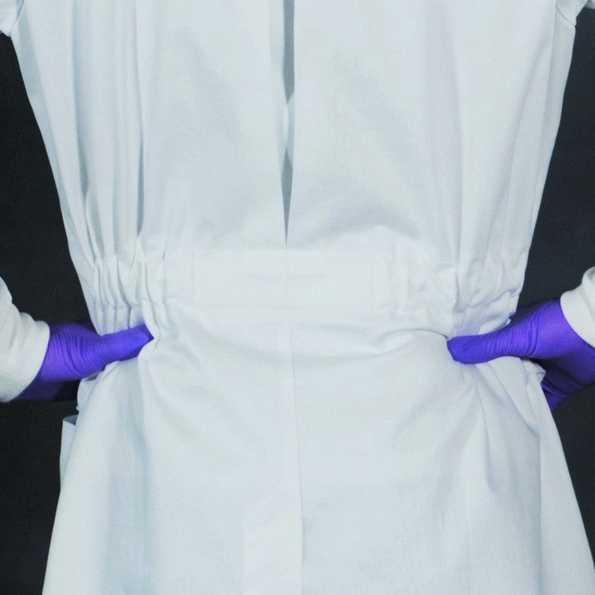 adjustable belt on a men's white cotton lab coat