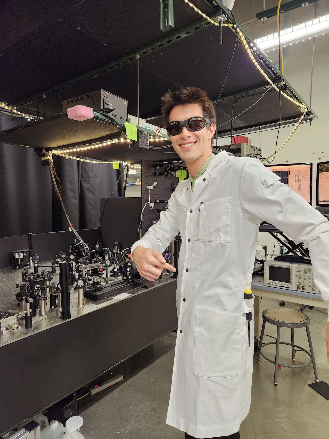 physics lab coat for lasers and optics work on tall graduate student