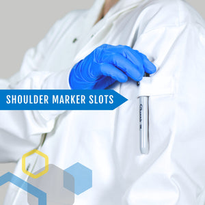 a woman 7 months pregnant sliding a black marker into a shoulder loop of a maternity lab coat for tool storage away from her chest