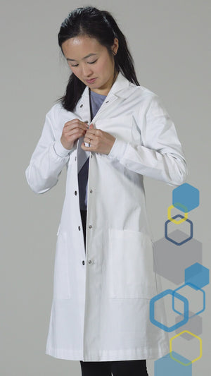 features overview of the Curie women's cotton chemistry lab coat showing knit cuffs, side vents, metal snaps, howie collar, and individual tool slots in pockets.