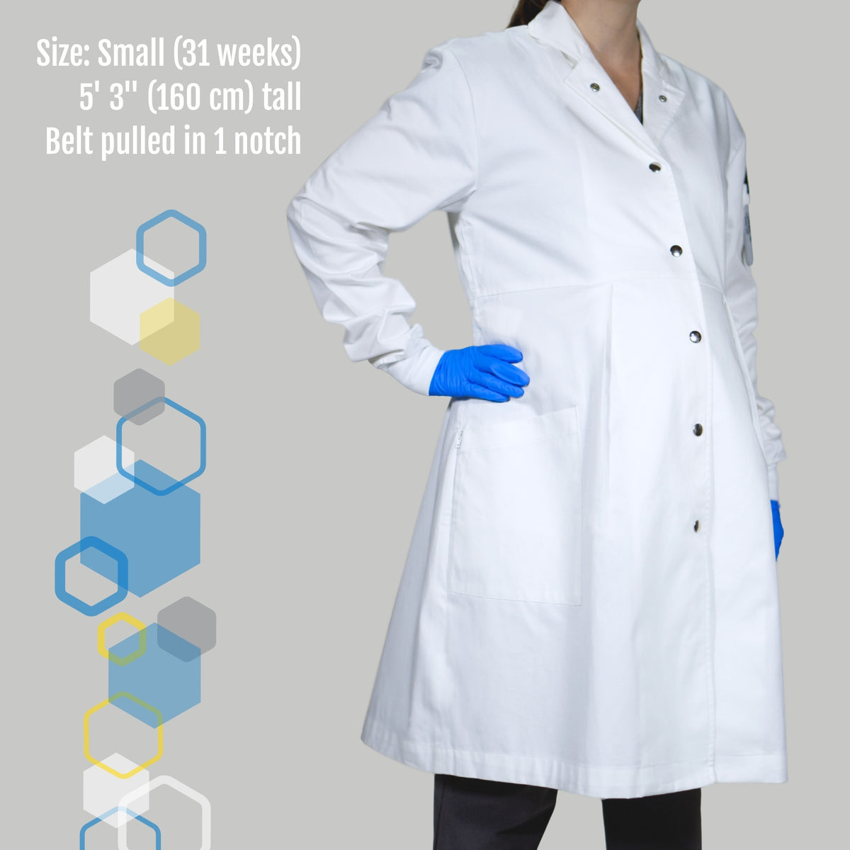 pregnant woman wearing a small maternity lab coat and purple nitrile gloves with the adjustable waist band pulled in to adjust fit during 3rd trimester. From Genius Lab Gear