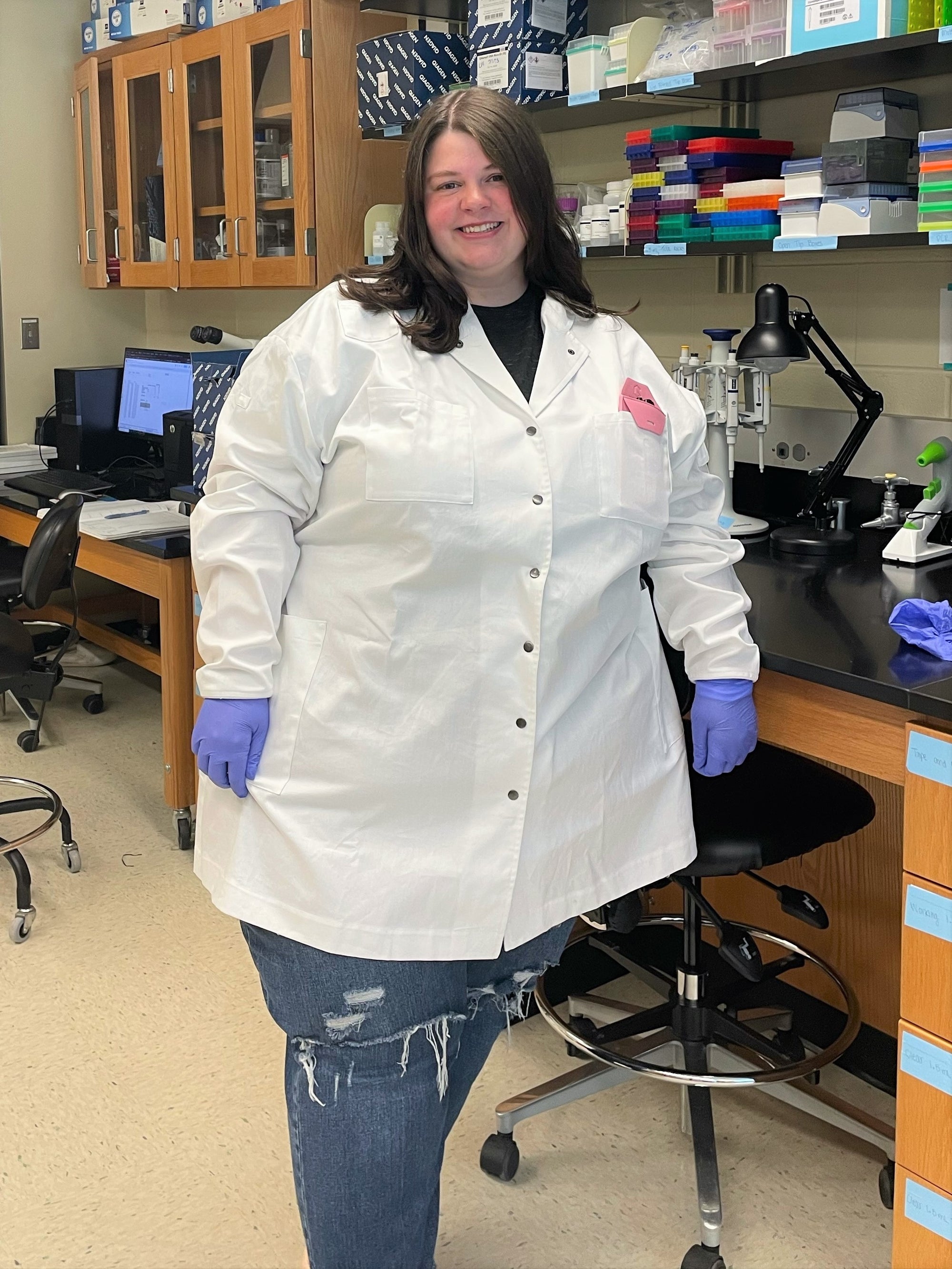 female scientist in lab wearing a white cotton lab coat 4xl