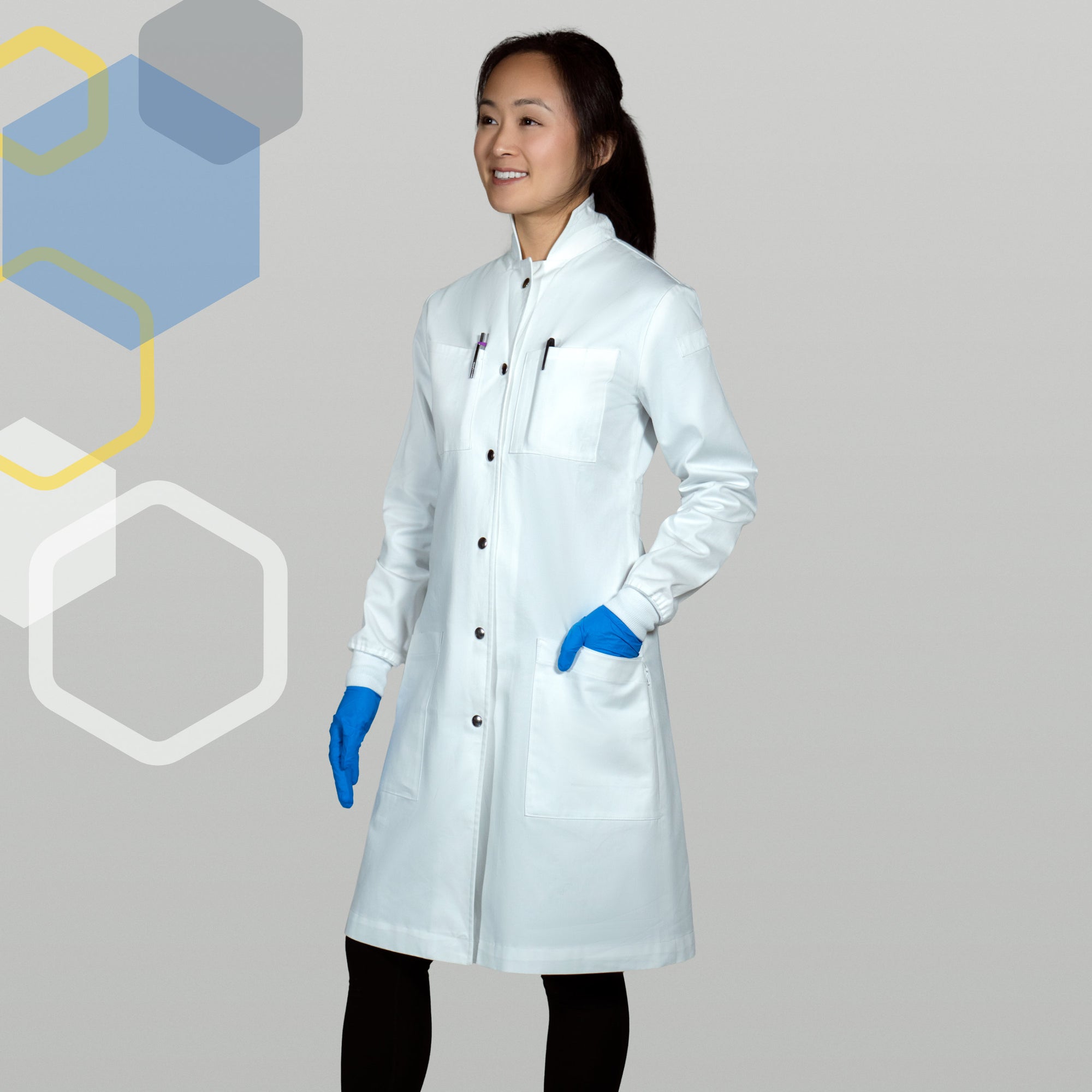 "Curie" women's chemistry lab coat with features of 100% cotton, cuffed sleeves, metal snaps, high collar, water resistant